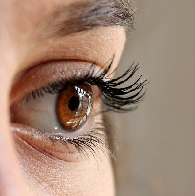 Woman getting fake eyelashes