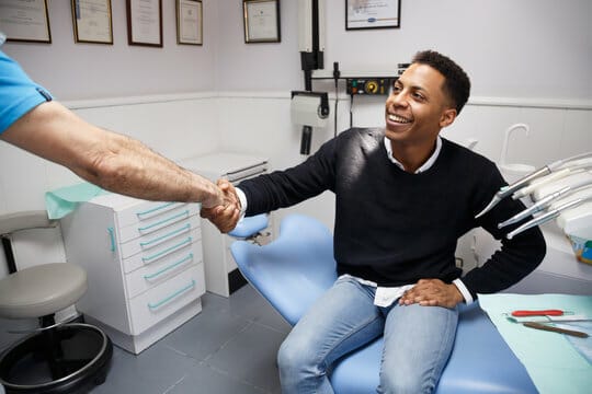 social media for dentists patient handshake