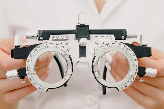 Optometrist holding an eyeframe
