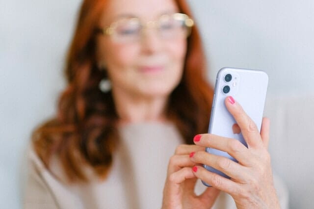 A woman holding a phone