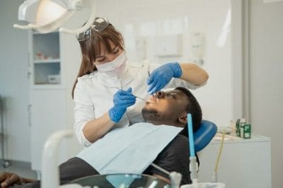 An orthodontist treating a patient
