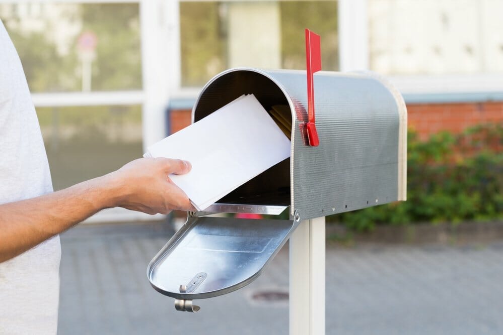 A person delivering direct mail for dental clinics
