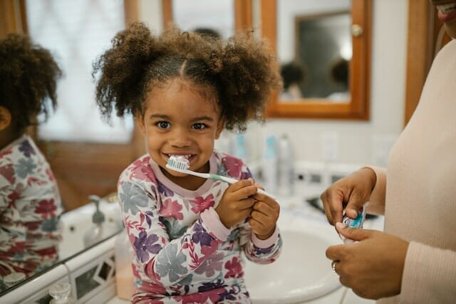 A child brushing her teeth