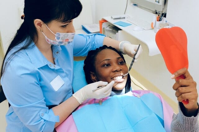 Dentist providing high-quality services to her patient