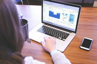 A woman monitoring Google Ads for Chiropractors