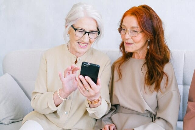 Two smiling women because of a mobile friendly site for chiropractors