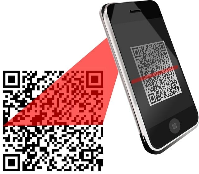Mobile device scanning a QR code from a plastic surgeon's clinic
