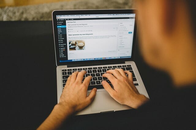 Person writing a blog post for a towing company