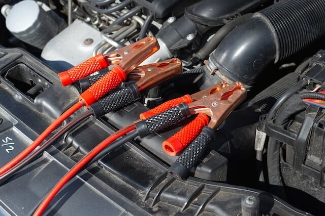 Car with wire problems being fixed at an auto repair shop