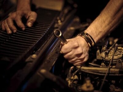 Mechanic repairing a broken car