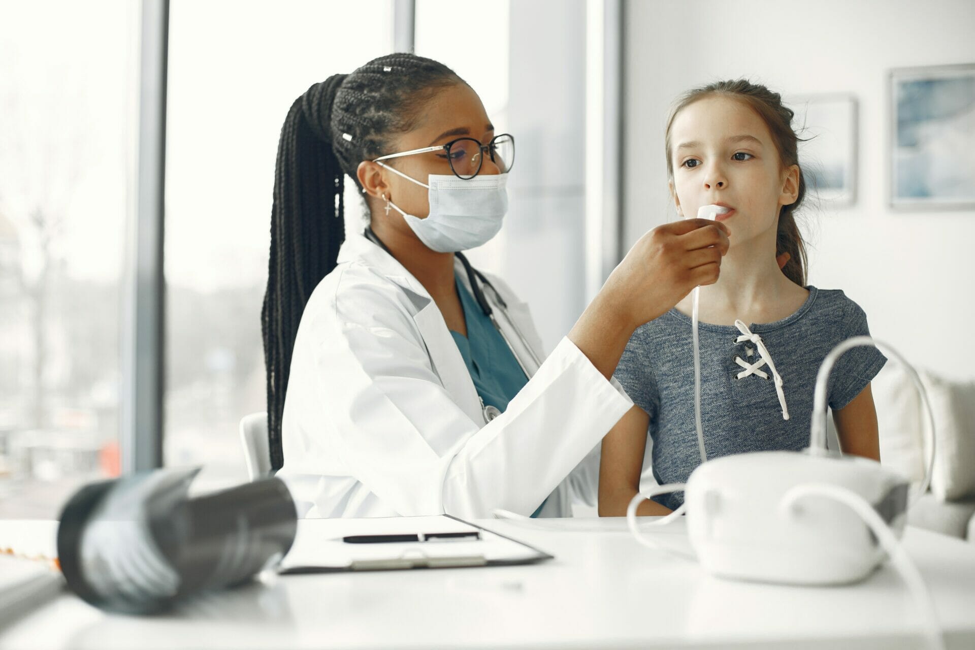 doctor giving general checkup as an ent pediatrician specialist