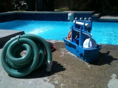Swimming pool with pool cleaning tools