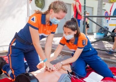 First aid workers practicing CPR