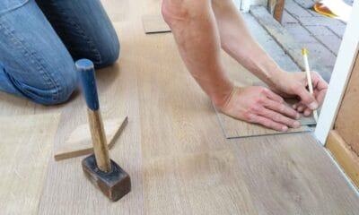 Man measuring floor